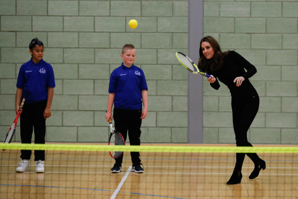 <p><span>While on a royal visit to Coach Core Essex, Middleton and Prince William met with students to talk about sports — but it was when the Duchess took to the courts in her heeled, black booties that she gained some serious respect. <em>(Photo via Getty Images)</em></span> </p>