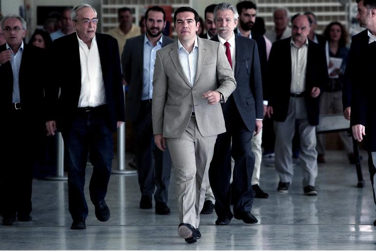 Greek Prime Minister Alexis Tsipras (C) said he would present his plan for reforms to end a gruelling four-month standoff