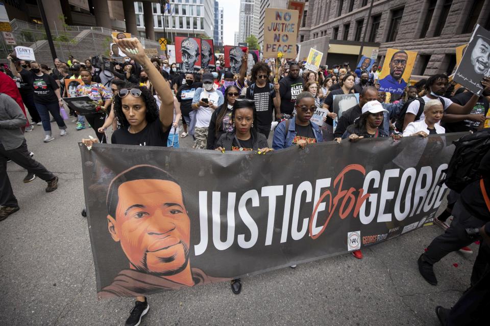 People march for the one year anniversary of George Floyd's death on Sunday, May 23, 2021, in Minneapolis, Minn. (AP Photo/Christian Monterrosa)