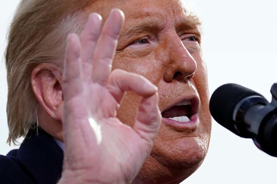 President Donald Trump speaks at a campaign rally at Manchester-Boston Regional Airport on Sunday: AP