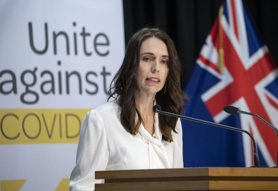 New Zealand's Prime Minister Jacinda Ardern address a press conference at the post-cabinet media conference at Parliament, in Wellington, New Zealand, Monday, April 20, 2020. Ardern on Monday announced the country will remain in a strict lockdown for another week before easing the rules to allow some parts of the economy to reopen. (Mark Mitchell/Pool photo via AP)