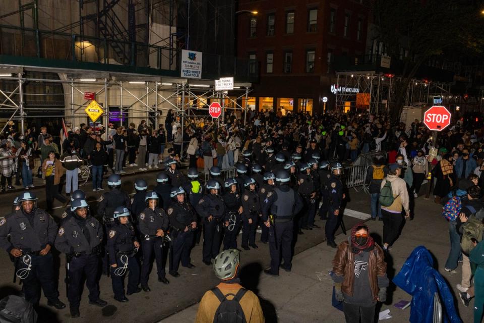 NYPD officers stand by after detaining demonstrators and clearing an encampment set up by pro-Palestinian students and protesters on the campus of New York University (NYU) (AFP via Getty Images)