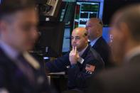 Traders work on the floor of the New York Stock Exchange shortly after the opening bell in New York April 4, 2014. REUTERS/Lucas Jackson