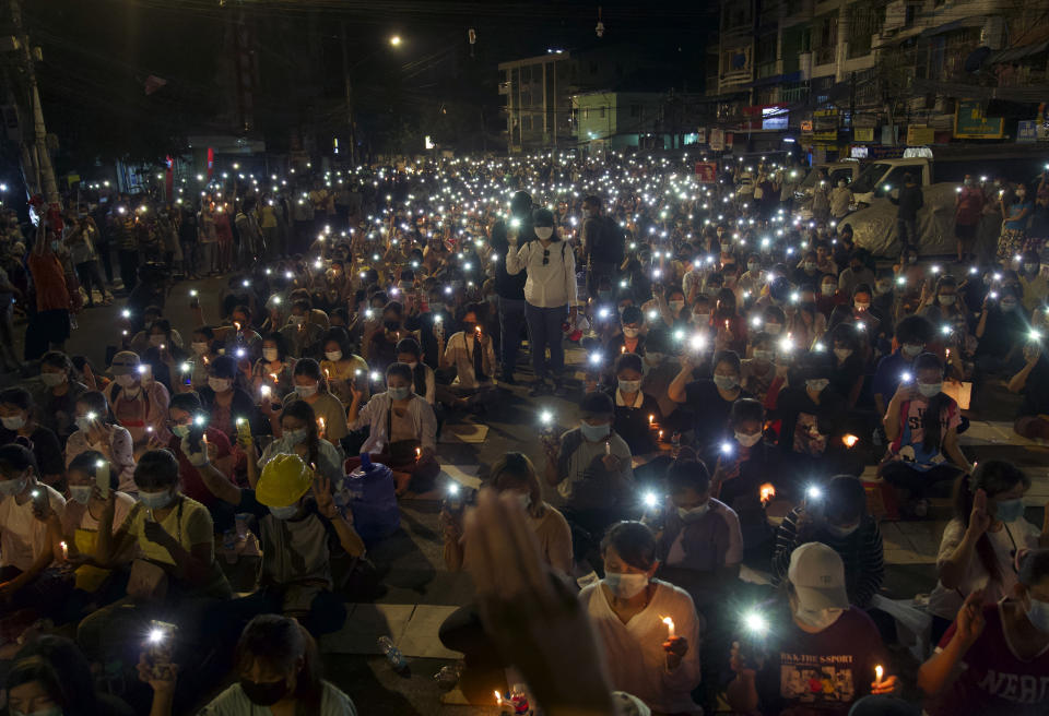 Anti-coup protesters turn on the LED light of their mobile phones during a candlelight night rally in Yangon, Myanmar Sunday, March 14, 2021. At least four people were shot dead during protests in Myanmar on Sunday, as security forces continued their violent crackdown against dissent following last month's military coup. (AP Photo)