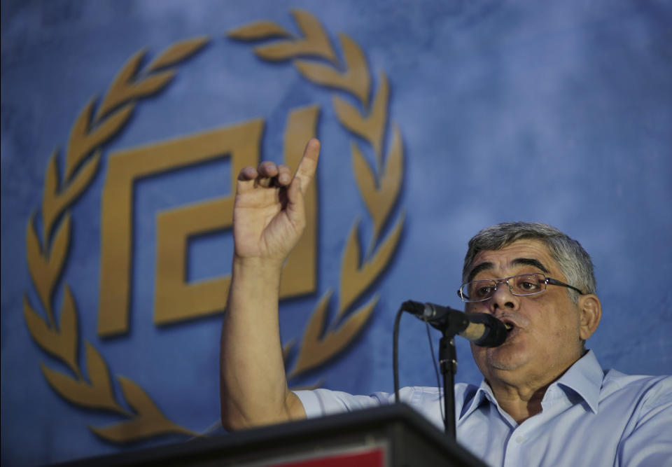 FILE - In this Wednesday, Sept. 16, 2015 file photo, Nikos Michaloliakos, the leader of the extreme far-right Golden Dawn political party, delivers his speech during a pre-election rally, in Athens. Greek police officials they are planning to deploy about 2,000 officers around Athens as the leadership of the extreme right group Golden Dawn faces a landmark criminal trial verdict. Eighteen former lawmakers from the party founded in the 1980s as a neo-Nazi organization are among 69 defendants who have been on trial for the past five years. The verdict is expected Wednesday Oct. 7, 2020. (AP Photo/Lefteris Pitarakis, File)