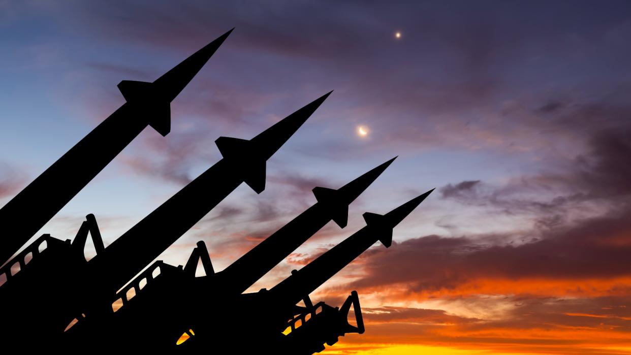  Missile system on the background of sunset sky. 