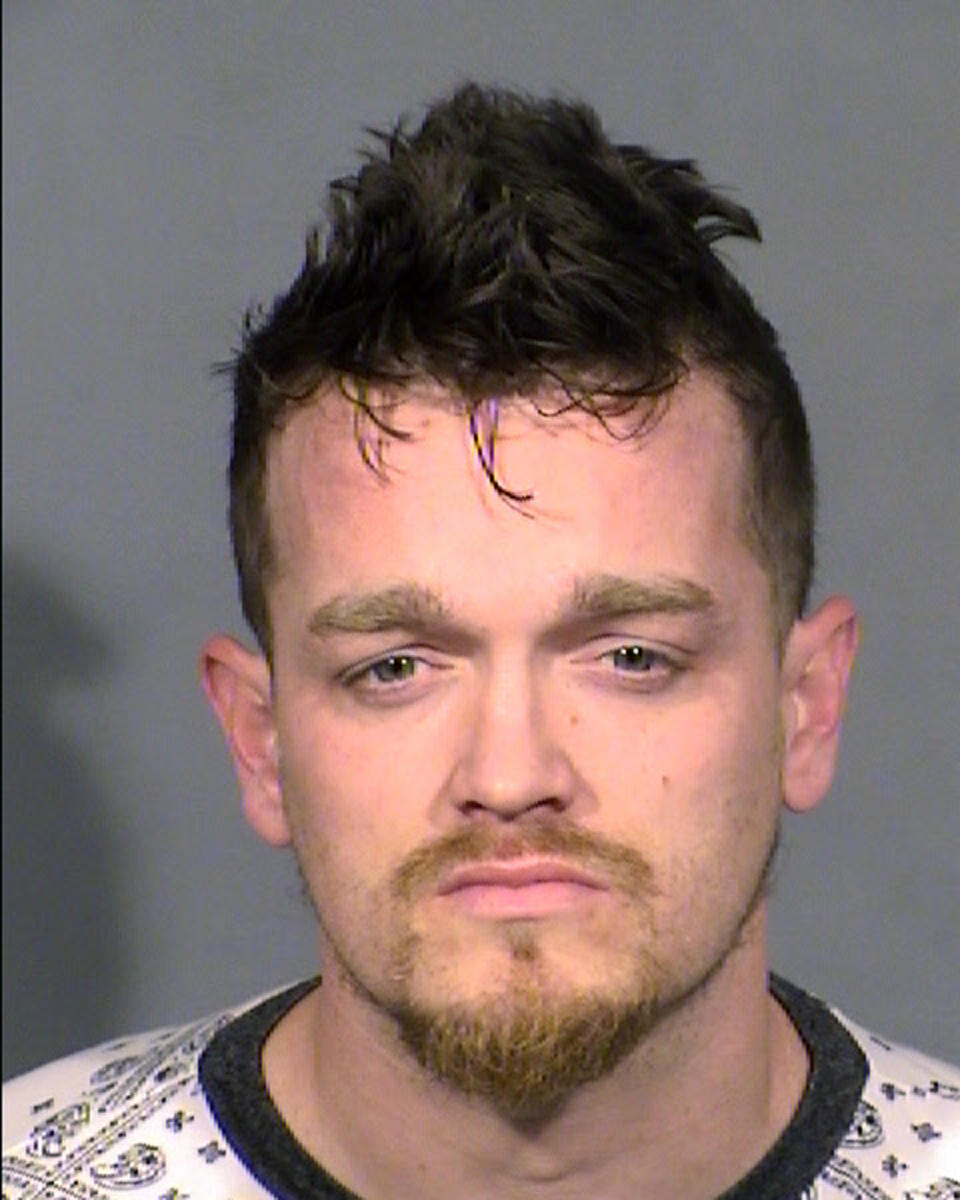 This Clark County Detention Center booking photo shows Brandon Lee Toseland, 35, of Las Vegas, following his arrest Tuesday, Feb. 22, 2022, on murder and kidnapping charges. Authorities say a schoolgirl gave a note to her teacher saying her mother was being held captive and had not seen the girl's younger brother in more than 10 weeks, leading to the discovery of the boy's body in a garage freezer and Toseland's arrest. Toseland made an initial court appearance Wednesday, Feb. 23, 2022, on two kidnapping charges before a Las Vegas judge who ordered him to remain jailed pending an appearance Thursday on an open murder charge. (Las Vegas Metropolitan Police Department via AP)