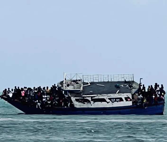 Haitian migrants are gathered on a wooden vessel that grounded off Ocean Reef Club in Key Largo Sunday, March 6, 2022.