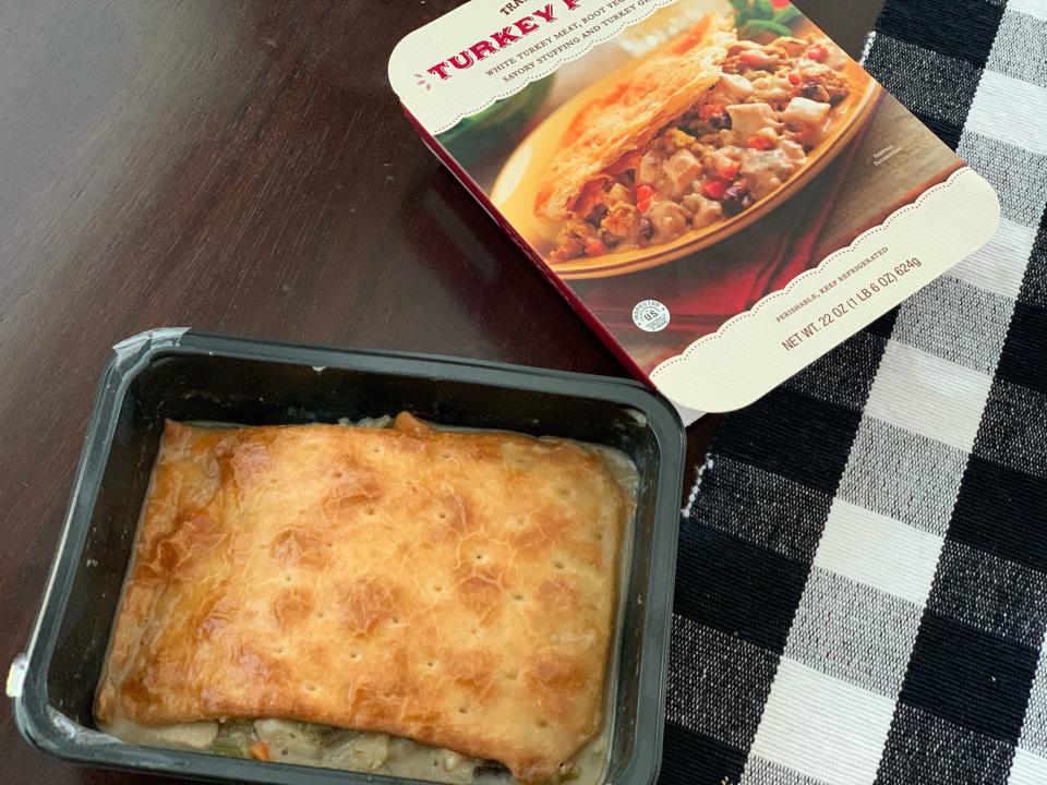 package of trader joes pot pie beside uncooked tray