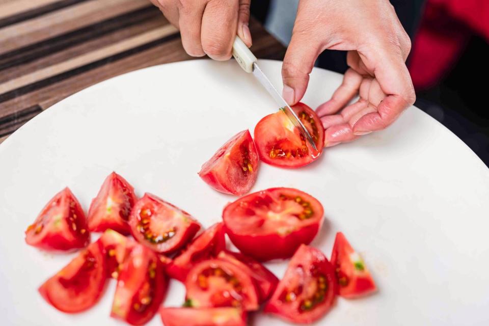 Slicing a tomato into wedges