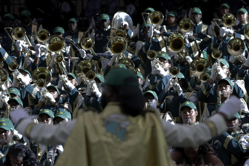 The Norfolk State University Spartan Legion marching band performs in the stands during the 2023 National Battle of the Bands, a showcase for HBCU marching bands, held at NRG Stadium, Saturday, Aug. 26, 2023, in Houston. (AP Photo/Michael Wyke)