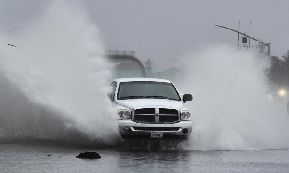 A vehicle slams into a flooded offramp at Gregory Lane on southbound I-680 in Pleasant Hill, California, as a powerful storm barreled toward the area.