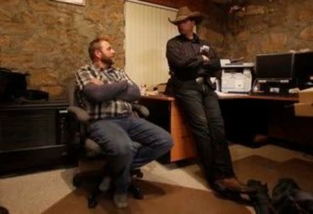 Ammon Bundy (L), and his brother Ryan Bundy are shown in an office at the Malheur National Wildlife Refuge near Burns, Oregon, January 6, 2016. REUTERS/Jim Urquhart