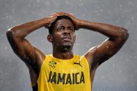 <p>Deuce Carter of Jamaica reacts as it rains during the Men’s 110m Hurdles Round 1 – Heat 2 on Day 10 of the Rio 2016 Olympic Games at the Olympic Stadium on August 15, 2016 in Rio de Janeiro, Brazil. (Getty) </p>
