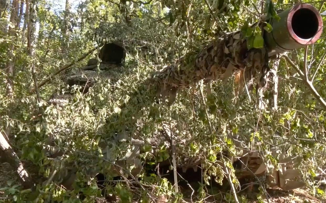 A Russian tank takes up a firing position in the Kursk region