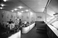 <p>Passengers dine comfortably in the luxurious dining area of the Hindenburg dirigible during the 1930s. (Corbis via Getty Images) </p>