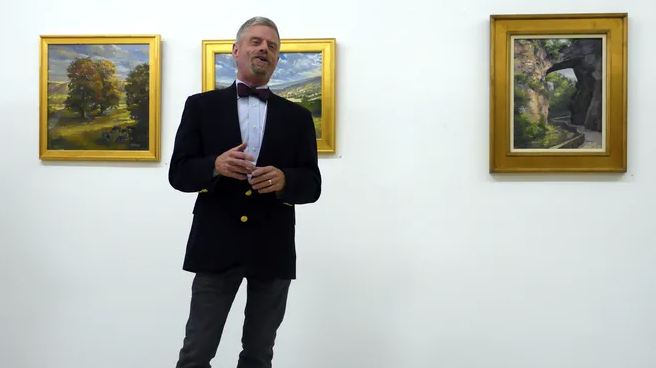 M. Stephen Doherty, of Waynesboro, Va., speaks about his plein air paintings at the opening of his exhibition, "Perceptions of Virginia," at the Beverley Street Studio School Gallery on Friday, Nov. 13, 2015.