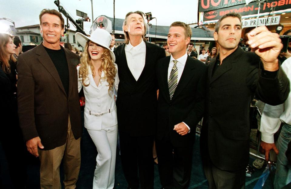 <p>From left to right, actors and the director of Batman and Robin, Arnold Schwarzenegger, Alicia Silverstone, the film's director Joel Schumacher, Chris O'Donnell and George Clooney, pose for the press during the premier of "Batman and Robin" 12 June in Los Angeles. (HECTOR MATA/AFP via Getty Images)</p> 