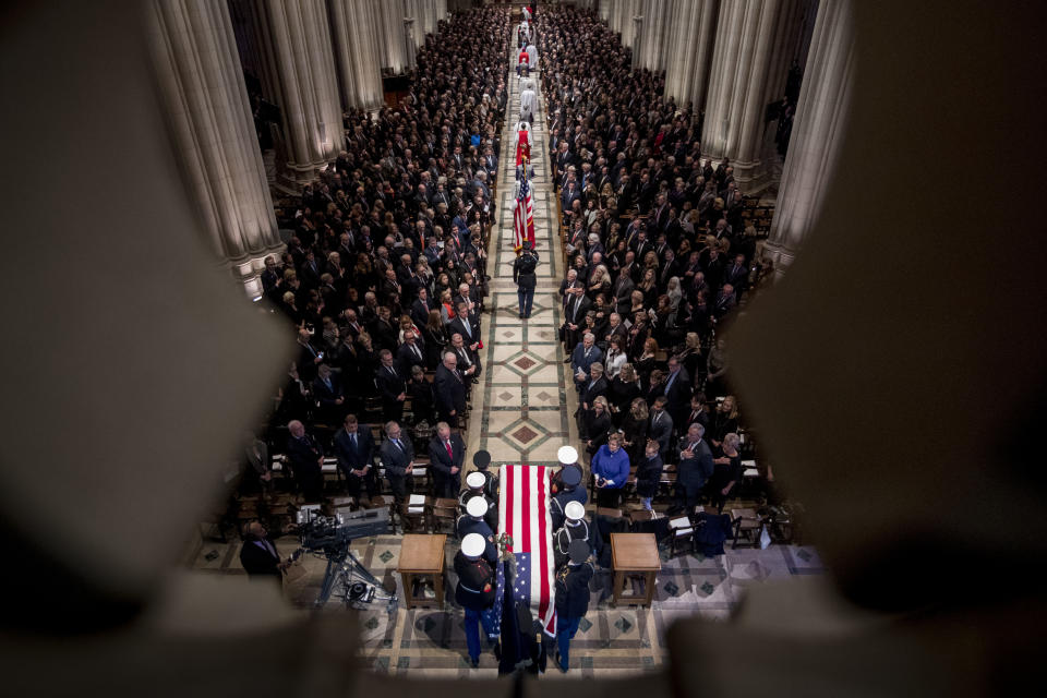 The flag-draped casket of former President George H.W. Bush is carried by a military honor guard during a State Funeral at the National Cathedral, Wednesday, Dec. 5, 2018, in Washington. (Photo: Andrew Harnik, Pool/AP)