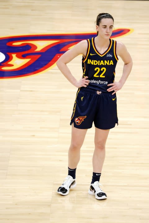 INDIANAPOLIS, IN – MAY 09: Indiana Fever guard Caitlin Clark (22) waits in the backcourt as a teammate shoots a free throw against the Atlanta Dream during a WNBA preseason game on May 9, 2024, at Gainbridge Fieldhouse in Indianapolis, Indiana. (Photo by Brian Spurlock/Icon Sportswire via Getty Images)