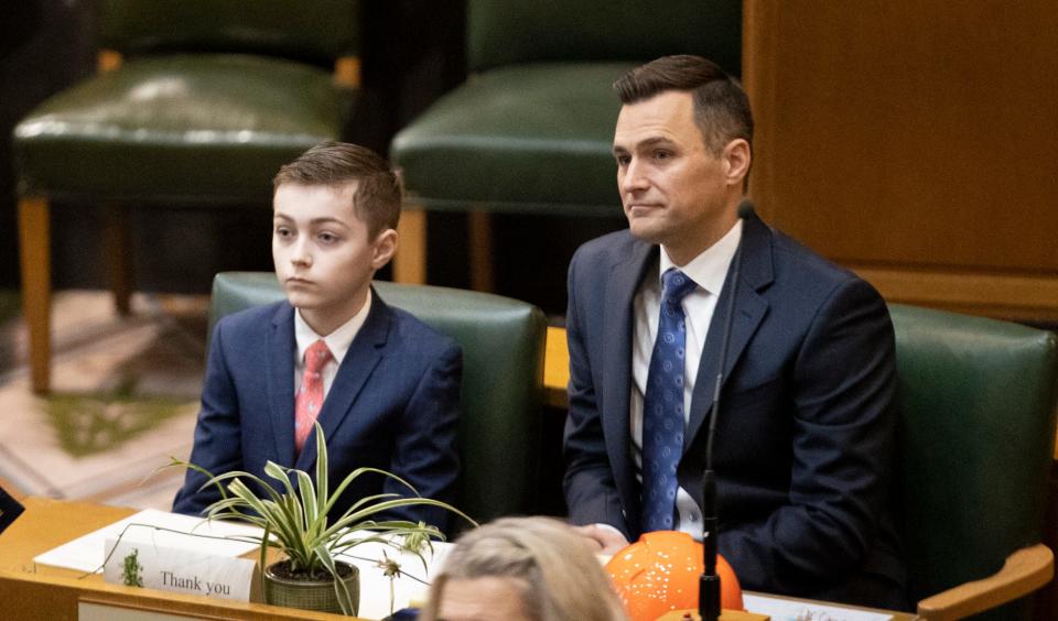 House Speaker Dan Rayfield, D-Corvallis, and his son look on during Monday's inauguration at the Oregon State Capitol.