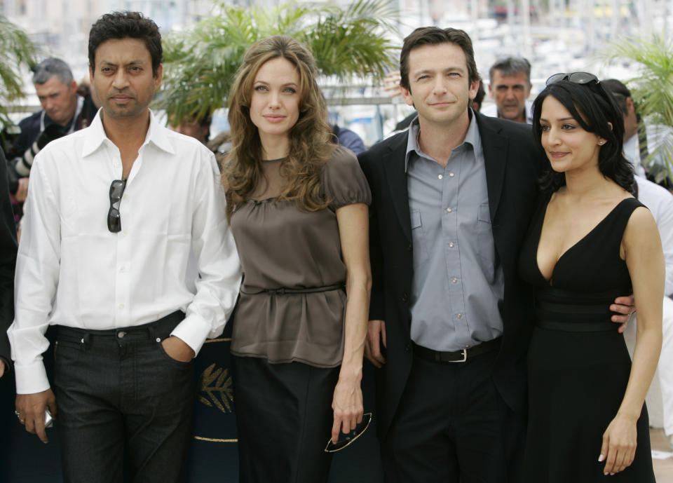 FILE - In this May 21, 2007 file photo, Indian actor Irrfan Khan, from left, American actress Angelina Jolie, American actor Dan Futterman and British actress Archie Panjabi pose during a photo call for the film "A Mighty Heart," at the 60th International film festival in Cannes, southern France. Khan has appeared in films such as “Slumdog Millionaire” and “Jurassic World,” but now the actor is facing the biggest challenge of his life as he undergoes treatment for cancer in London. (AP Photo/Andrew Medichini, File)