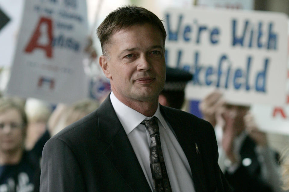 FILE - In this July 16, 2007 file photo Andrew Wakefield arrives at the General Medical Council in London to face a disciplinary panel investigating allegations of serious professional misconduct. Wakefiield's work first linked vaccines and autism but it has since been discredited. Amid a measles outbreak in Minnesota, he has been meeting with local Somalis in Minneapolis. Some worry Wakefield is stoking vaccination fears, though organizers say the meetings are merely informational discussions. (AP Photo/Sang Tan, File)