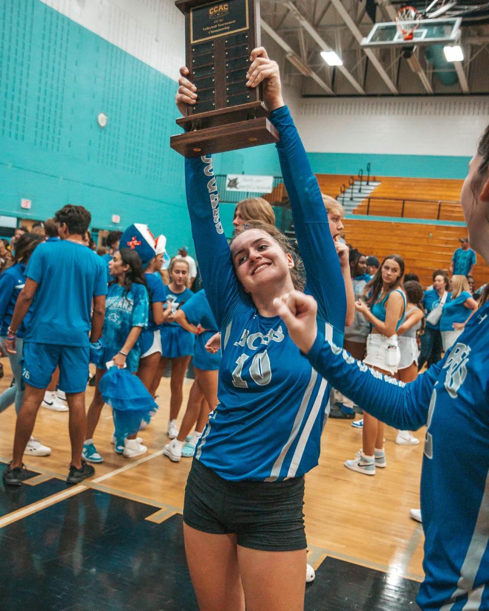 Barron Collier played Gulf Coast for the 2022 Collier County Athletic Conference title on Wednesday. The Cougars came back from two games down to beat the Sharks and win the crown 3-2. Barron Collier's Keira Kruk holds the CCAC trophy.