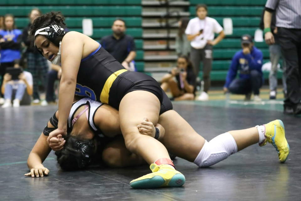 Bloomfield's Amia Goins holds Volcano Vista's Elena Moya to the mat in the first round of the 185 lbs. championship match during the Girls Region 1 Championships, Saturday, Feb. 4, 2023 at Scorpion Gym. Goins defeated Moya by pinfall in the second round.