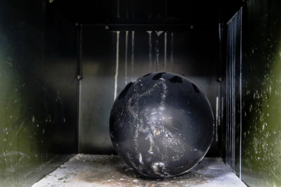 An abandoned bowling ball at the General Electric employee clubhouse.