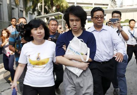 Teen blogger Amos Yee leaves with his parents after his sentencing from the State Court in Singapore July 6, 2015. REUTERS/Edgar Su/Files