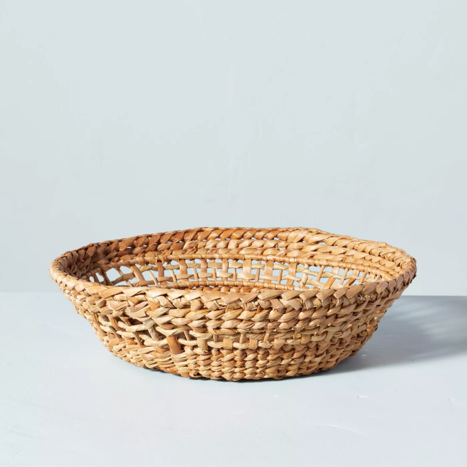 natural woven basket on blue backdrop