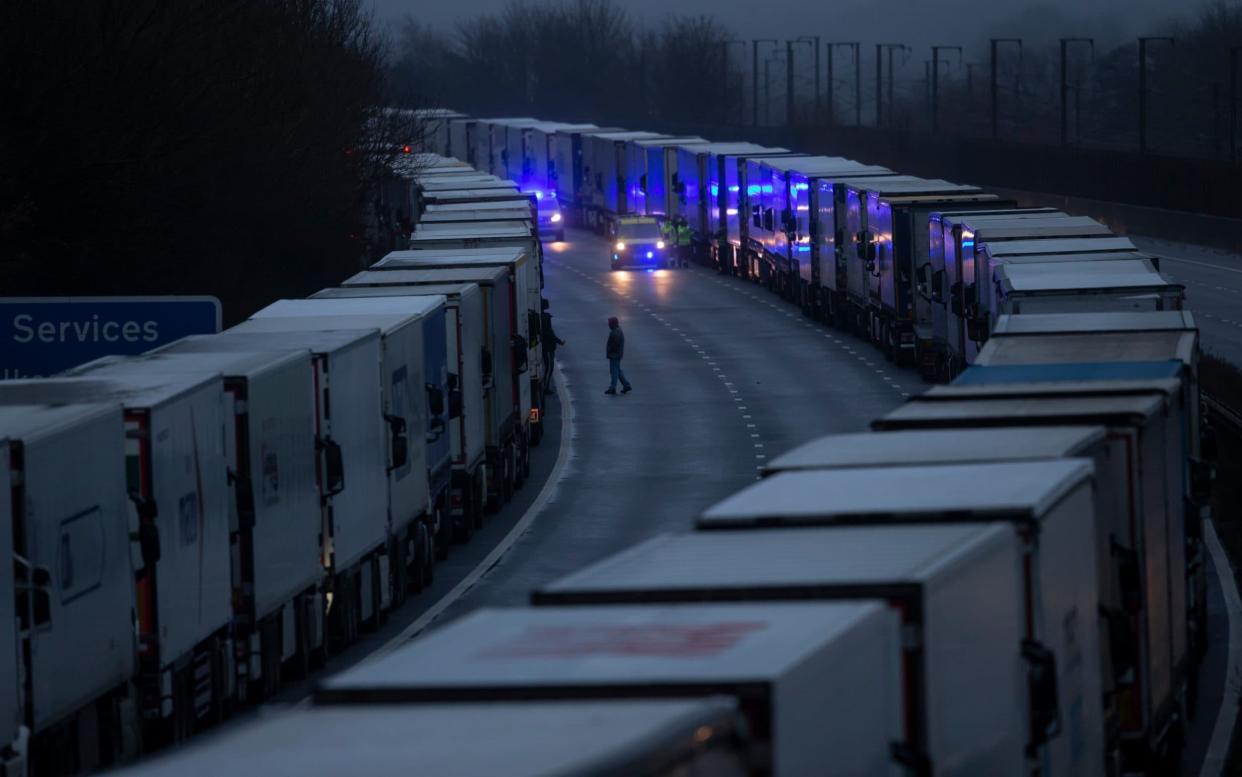 Lorries queue on the M20 on December 21, 2020 in Sellindge, Kent, after France temporarily closed its border with the UK - Dan Kitwood/Getty Images Europe