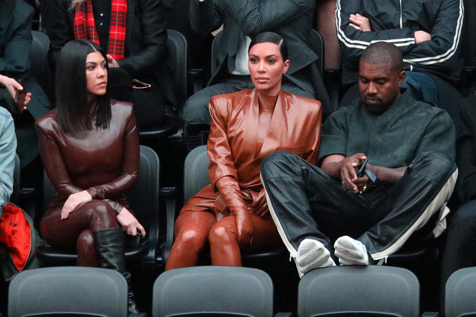 PARIS, FRANCE - MARCH 01: (EDITORIAL USE ONLY) Kourtney Kardashian,Kim Kardashian and Kanye West attend the Balenciaga show as part of the Paris Fashion Week Womenswear Fall/Winter 2020/2021 on March 01, 2020 in Paris, France. (Photo by Pierre Suu/Getty Images)