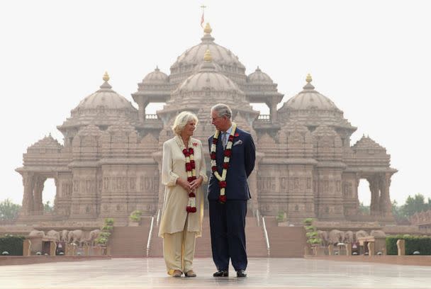 PHOTO: Camilla, Duchess of Cornwall and Prince Charles, Prince of Wales pose outside the Akshardham Temple during a visit to India on Nov. 8, 2013 in Delhi, India.  (Getty Images)