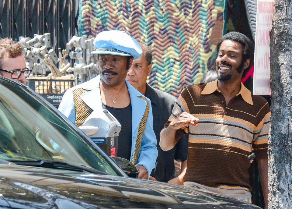 Chris Rock and Eddie Murphy on set together. (Photo: Getty Images)