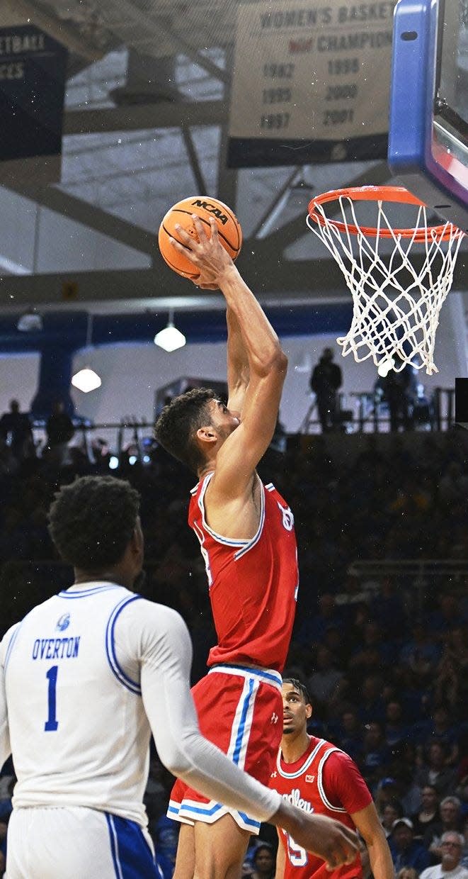 Bradley Braves forward Malevy Leons dunks during BU's 74-66 loss to Drake at Knapp Center in Des Moines, Iowa in the Missouri Valley Conference regular-season finale for both teams Sunday, March 3, 2024.