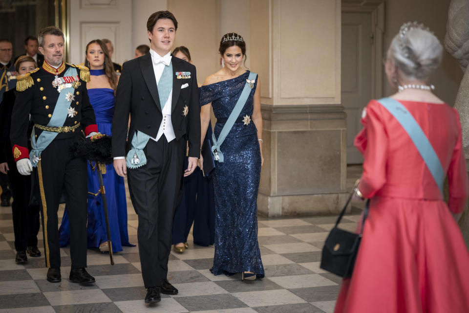 FILE - Denmark's Crown Prince Frederik, Crown Princess Mary and Prince Christian are greeted by Queen Margrethe II, as they arrive for a gala dinner to celebrate Prince Christian's 18th birthday, at Christiansborg Castle, in Copenhagen, Sunday, Oct. 15, 2023. As a teenager, Crown Prince Frederik felt uncomfortable being in the spotlight, and pondered whether there was any way he could avoid becoming king. All doubts have been swept aside as the 55-year-old takes over the crown on Sunday, Jan. 14, 2024 from his mother, Queen Margrethe II. (Mads Claus Rasmussen/Ritzau Scanpix via AP, File)
