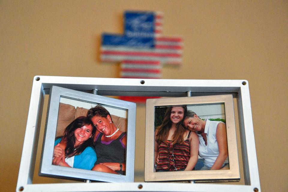 Photographs of Yolande Kneuer, 57, with her daughter, Sierra Fawcett, are on display in her home, Tuesday, Dec. 6, 2022, in Stuart. Kneuer has recently started a balloon and flower delivery service, A Hug and a Smile, after her battle with a mental health disorder, homelessness and psychiatric hospitalizations.
(Photo: CRYSTAL VANDER WEIT/TCPALM)