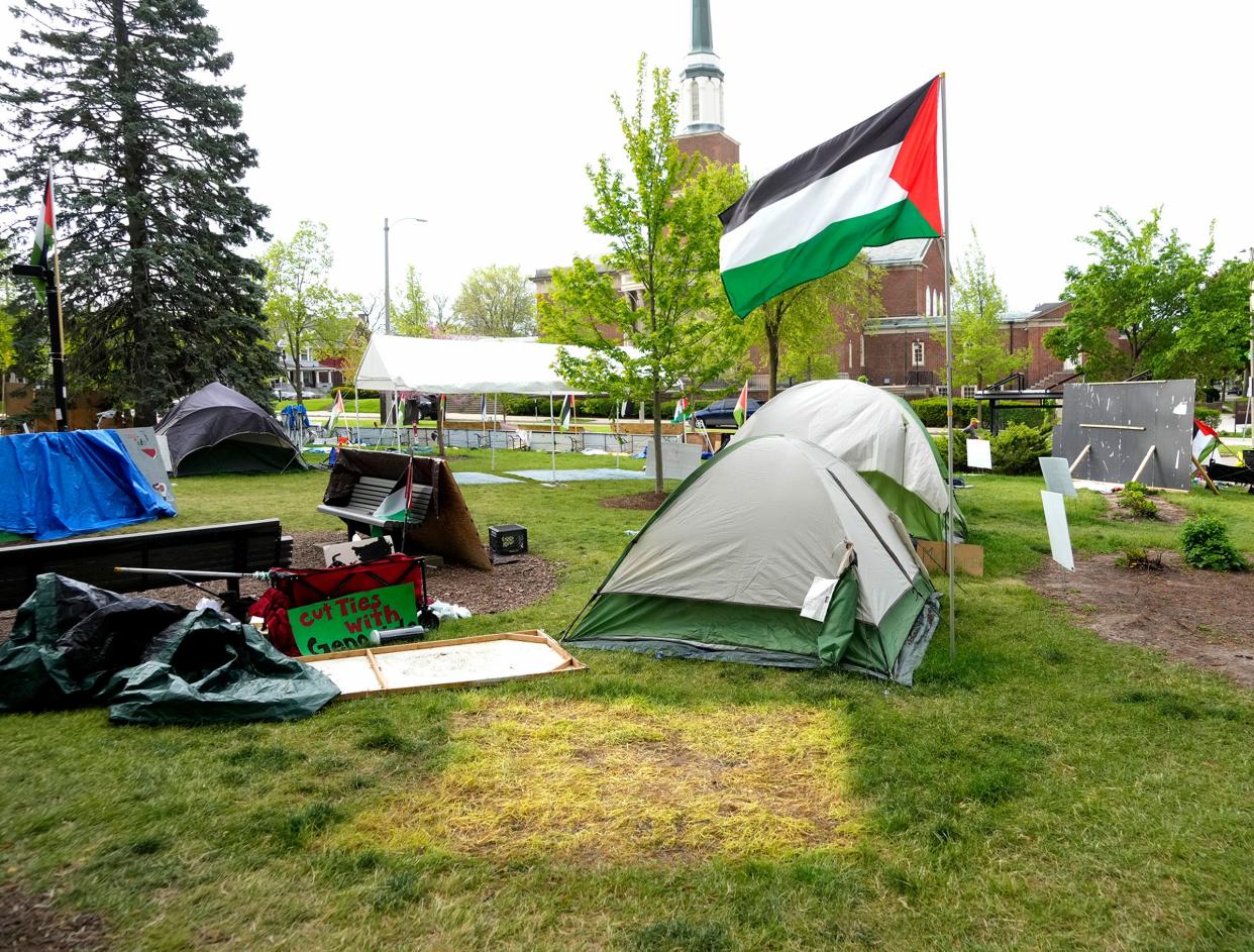 A bare spot is left where a tent was taken down at an encampment outside Mitchell Hall on the University of Wisconsin-Milwaukee campus on Monday. The tents were part of a protest against the Israel-Hamas war. UWM and pro-Palestinian protesters reached an agreement Sunday afternoon, two weeks after tents went up on the lawn outside Mitchell Hall, in defiance of a state rule banning camping on campus property.