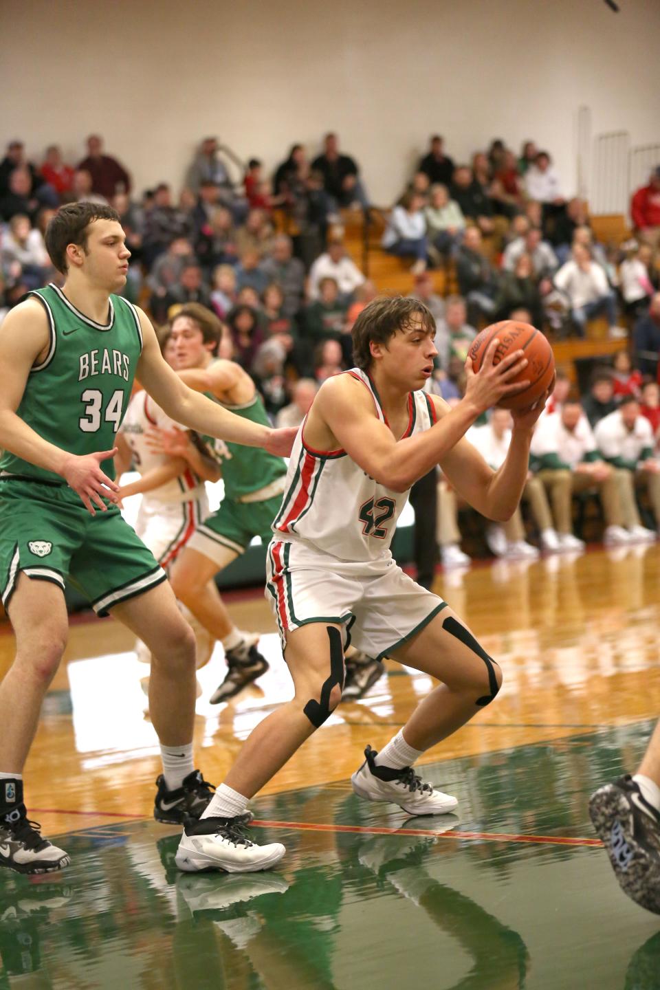 Oak Harbor's Dan Allen grabs a rebound.