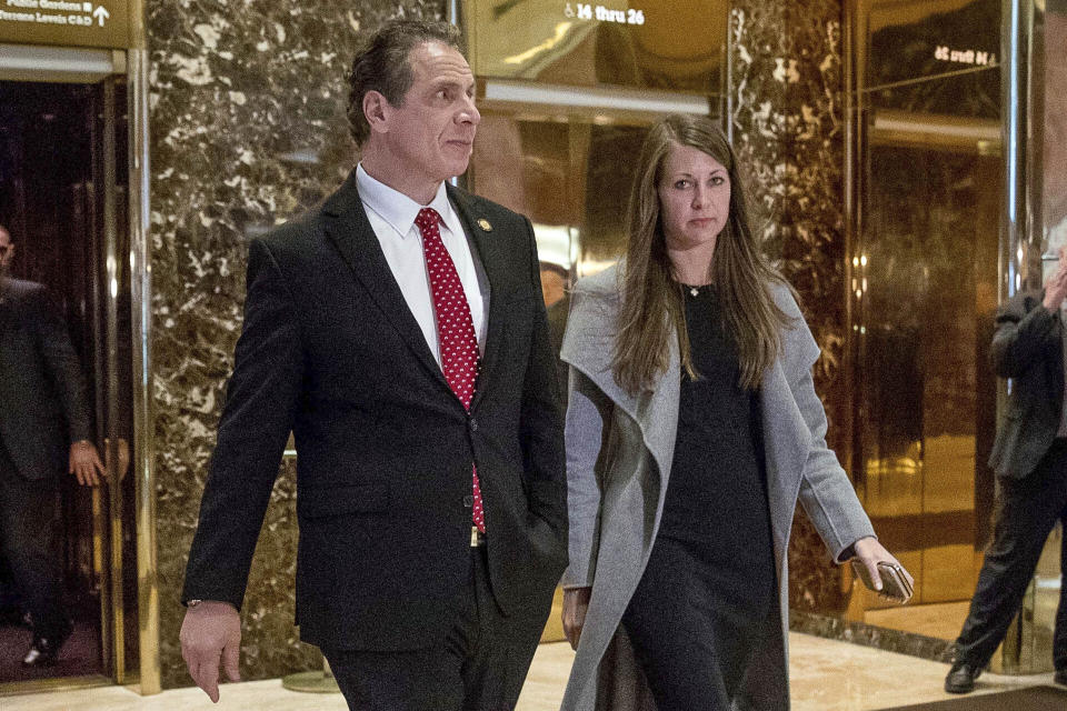 FILE - In this Jan. 18, 2017, file photo, New York Gov. Andrew Cuomo, accompanied by Melissa DeRosa, walks to talk with reporters after meeting with President-elect Donald Trump at Trump Tower in New York. Top aides to Cuomo altered a state Health Department report to obscure the true number of people killed by COVID-19 in the state's nursing homes, The Wall Street Journal and The New York Times reported late Thursday, March 4, 2021. The aides, including DeRosa, pushed state health officials to edit the July report so only residents who died inside long-term care facilities, and not those who became ill there and later died at a hospital, were counted, the newspapers reported. (AP Photo/Andrew Harnik, File)