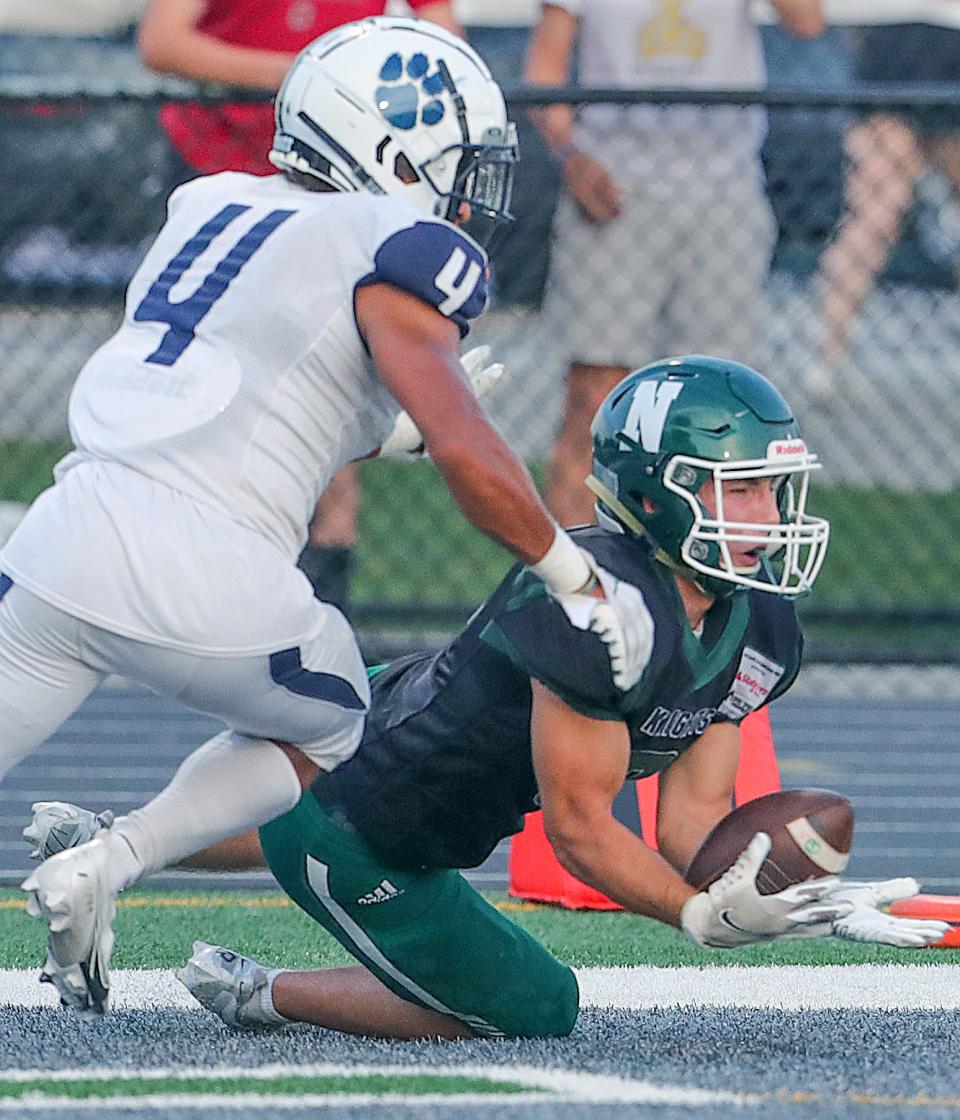 Nordonia receiver Tucker Rusk hauls in a first quarter touchdown pass in front of Twinsburg's Dalton Allen on Friday, Sept. 16, 2022 in Macedonia.