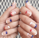 <p>Keep it simple with these negative space nails featuring alternating red, blue, and white French tips.</p><p><a class="link " href="https://www.amazon.com/Orly-Half-Moon-Guides-Count/dp/B00FMVR802/?tag=syn-yahoo-20&ascsubtag=%5Bartid%7C10072.g.27727694%5Bsrc%7Cyahoo-us" rel="nofollow noopener" target="_blank" data-ylk="slk:SHOP FRENCH MANI KIT;elm:context_link;itc:0;sec:content-canvas">SHOP FRENCH MANI KIT</a></p>