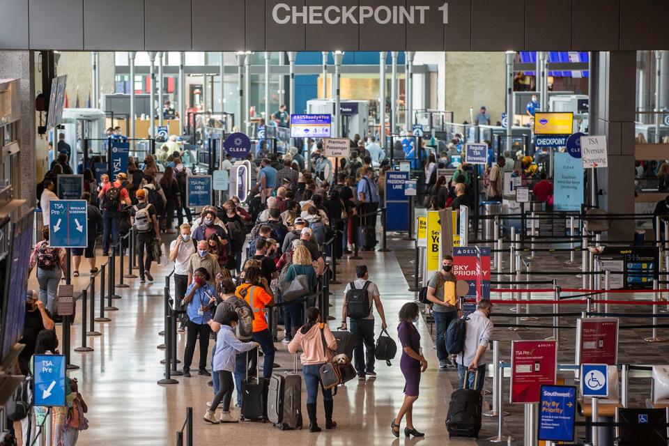 Travelers wait in line for TSA at Austin-Bergstrom International Airport on Friday, Dec. 17, 2021. Air travel is expected to be popular this Thanksgiving season, with an 8% increase across the nation.