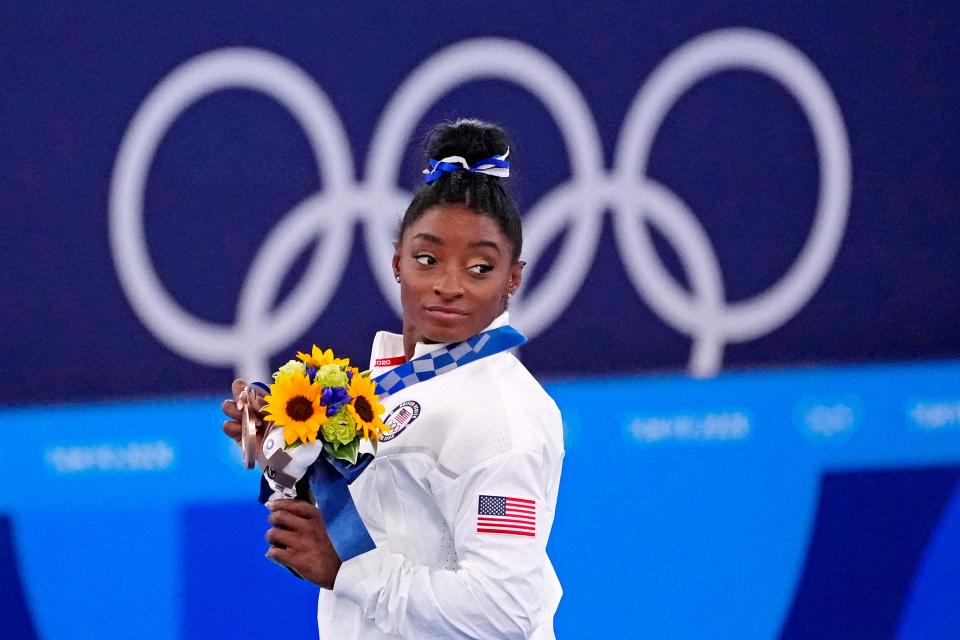 Aug 3, 2021; Tokyo, Japan; Simone Biles (USA) celebrates winning the bronze medal on the balance beam during the Tokyo 2020 Olympic Summer Games at Ariake Gymnastics Centre. Mandatory Credit: Robert Deutsch-USA TODAY Sports