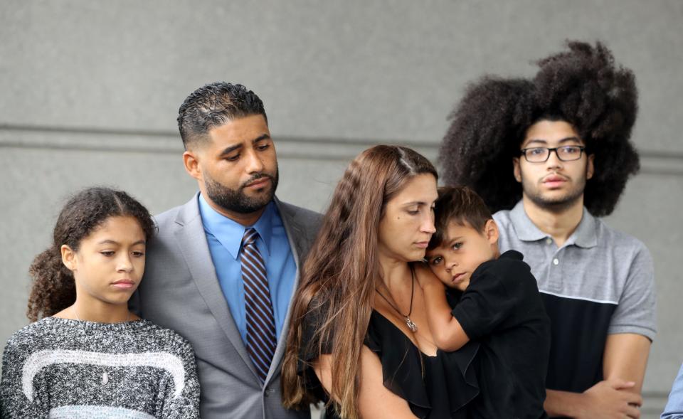 Juan Rodriguez of New City stands with his family outside the Bronx Hall of Justice after a court hearing Aug. 27, 2019. With him was his wife, Marissa, daughter Jenna, 12, son Jayden, 16, and son Tristan, 4. Rodriguez was making a court appearance in connection with the July hot car deaths of his nearly one-year old twins.