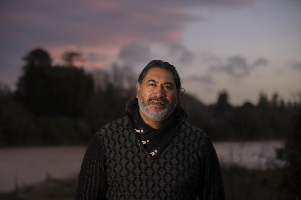 Geoff Hipango, who manages mental health and addiction services for a tribal provider in Whanganui and who lives in a Maori marae community, stands for a portrait on the banks of the Whanganui River in New Zealand on June 15, 2022. Hipango says he thinks it's going to take time — perhaps a generation or more — for the river's health to be fully restored but it's now on the right track. (AP Photo/Brett Phibbs)