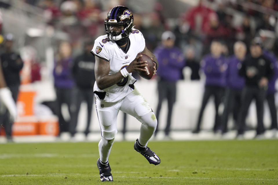 Baltimore Ravens quarterback Lamar Jackson rolls out against the San Francisco 49ers during the first half of an NFL football game in Santa Clara, Calif., Monday, Dec. 25, 2023. (AP Photo/Godofredo A. Vásquez)
