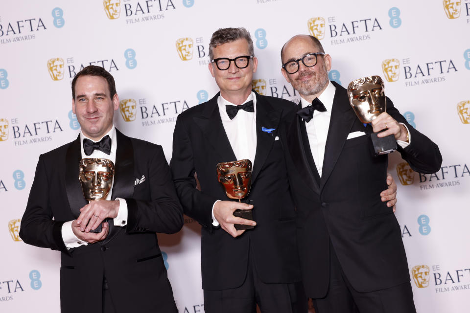 James Friend, from left, winner of the cinematography award, Malte Grunert and Edward Berger winners of the film not in the english language award for 'All Quiet on the Western Front', pose for photographers at the 76th British Academy Film Awards, BAFTA's, in London, Sunday, Feb. 19, 2023. (Photo by Vianney Le Caer/Invision/AP)